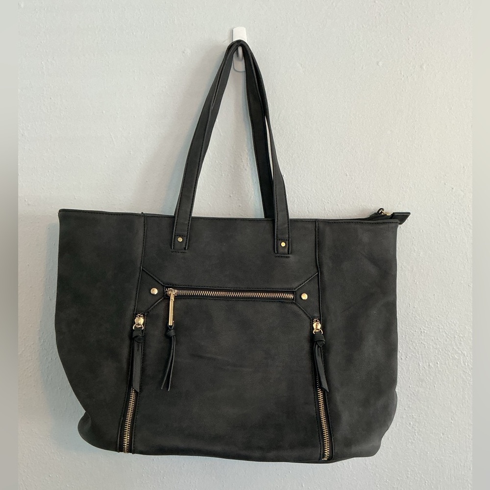 Black Tote Handbag with Gold Embellishments and Tassels.